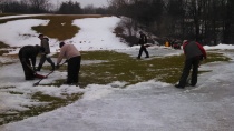 Ice removal from number two Ridge green, after the snow was removed.